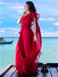 red bright ready pleated saree with ruffled pallo paired