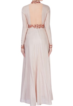 beige high collar gown with shiny bead detailing